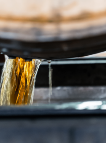 bourbon pouring out of a barrel